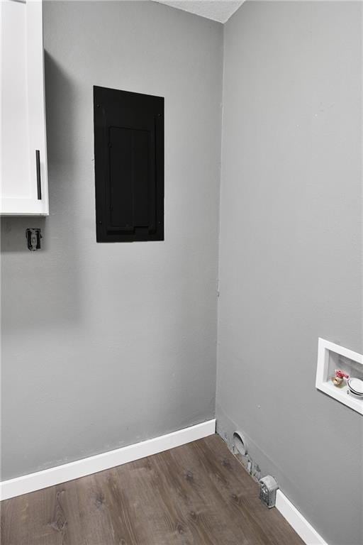 laundry area with electric panel, dark hardwood / wood-style flooring, and hookup for a washing machine