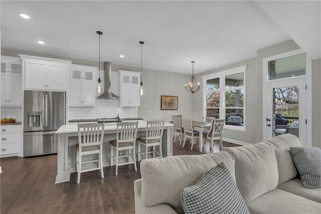 6975 W 162nd Ter, Overland Park, KS 66085 - living area with a chandelier, recessed lighting, and dark wood finished floors