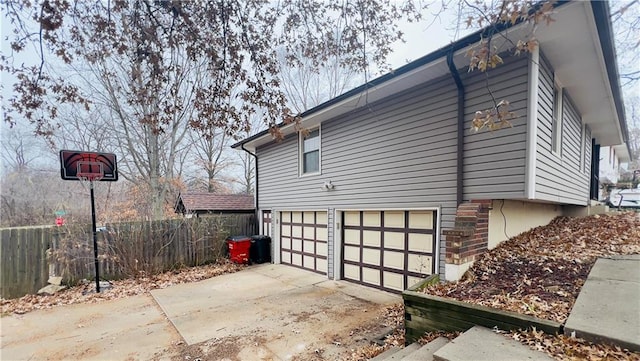 view of property exterior featuring a garage