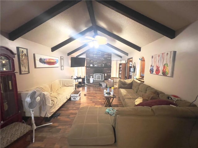 living room featuring lofted ceiling with beams, ceiling fan, a wood stove, and dark hardwood / wood-style floors