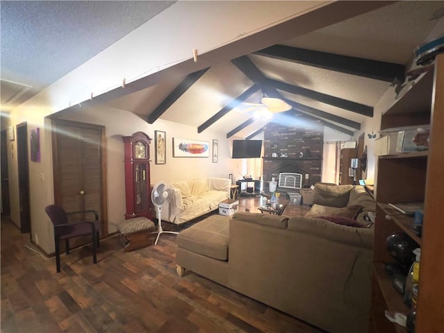 living room with a textured ceiling, ceiling fan, lofted ceiling with beams, and dark hardwood / wood-style floors