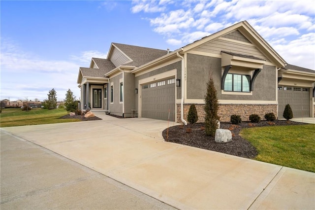 view of front of house featuring a front yard and a garage