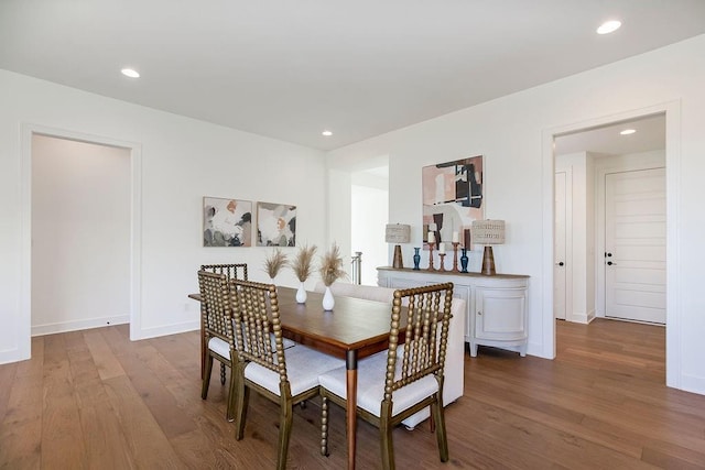 dining area with hardwood / wood-style floors