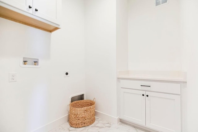 laundry area featuring washer hookup, electric dryer hookup, and cabinets