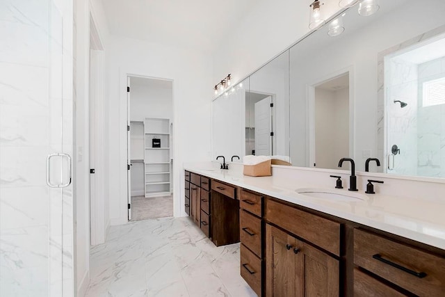 bathroom with vanity and a shower with shower door