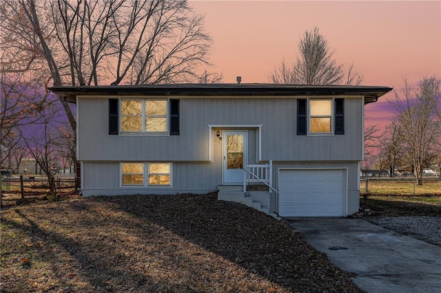 split foyer home featuring a garage