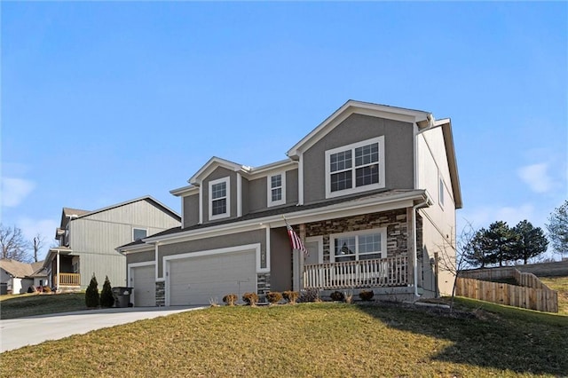 view of front facade with a porch, a garage, and a front yard