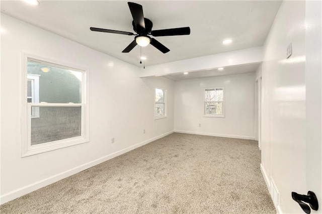 carpeted empty room with ceiling fan