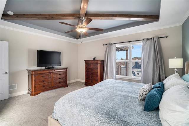 bedroom featuring ceiling fan, beamed ceiling, a tray ceiling, crown molding, and light carpet