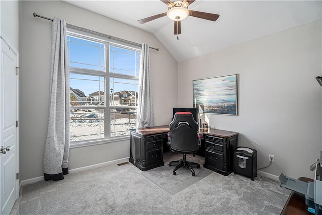 carpeted office featuring ceiling fan and vaulted ceiling