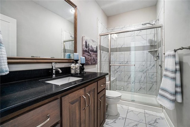 bathroom featuring toilet, an enclosed shower, and vanity