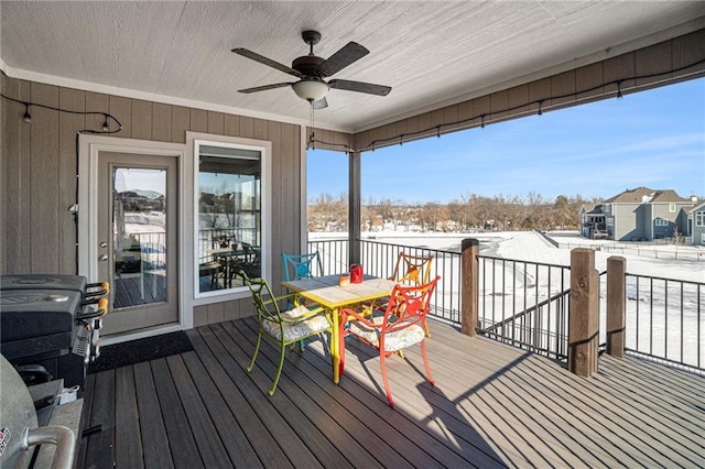 snow covered deck with ceiling fan