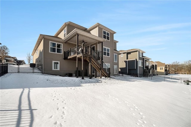 snow covered house with ceiling fan