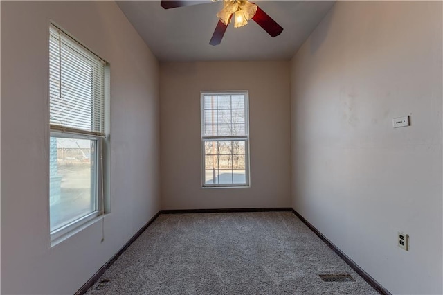 carpeted empty room featuring ceiling fan