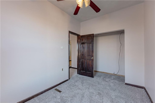 unfurnished bedroom featuring light colored carpet and ceiling fan