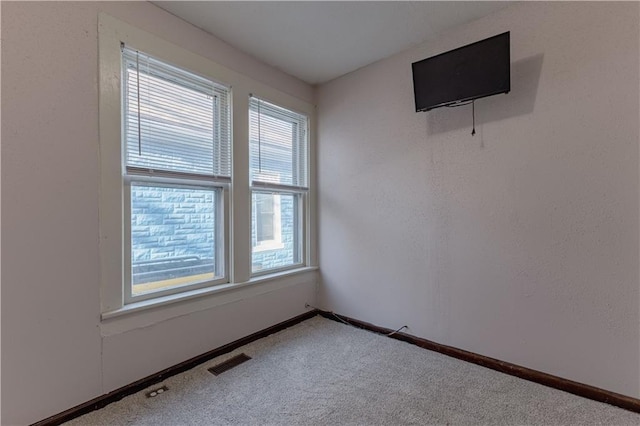 empty room with carpet flooring