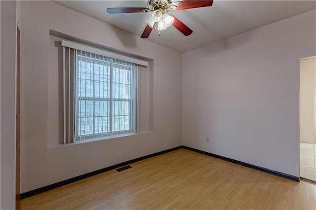 unfurnished room with ceiling fan and light hardwood / wood-style flooring