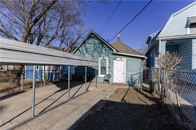 exterior space with a carport