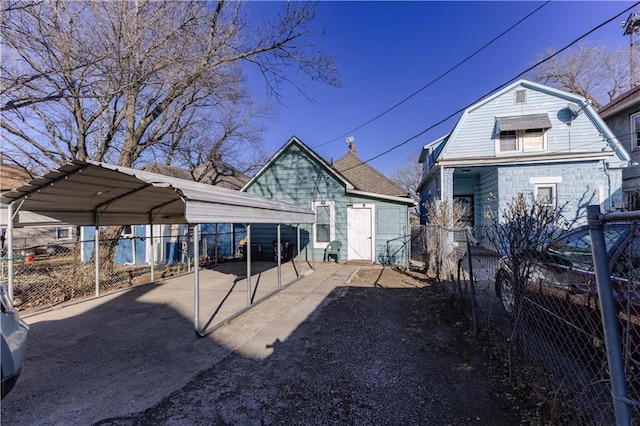 exterior space with a carport