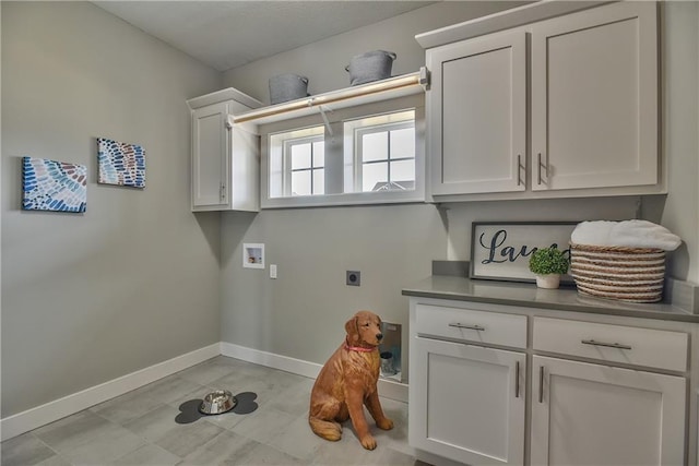 laundry area with cabinets, washer hookup, and hookup for an electric dryer