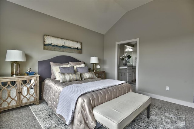 carpeted bedroom with lofted ceiling and connected bathroom