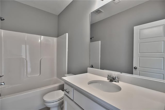 full bathroom with vanity, tub / shower combination, and toilet