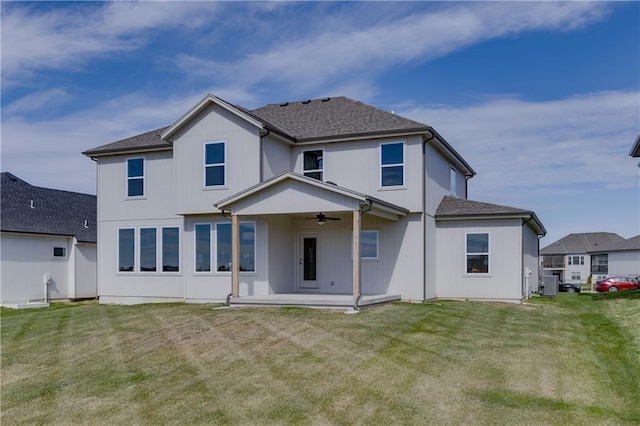 back of property featuring a patio, central air condition unit, ceiling fan, and a lawn