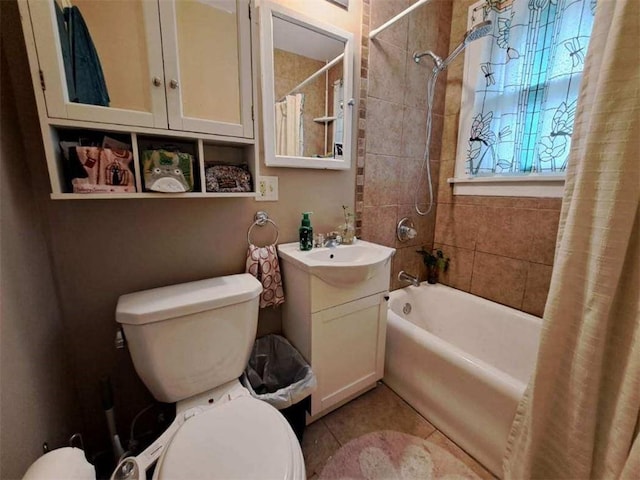 full bathroom with tile patterned floors, vanity, toilet, and shower / bathtub combination with curtain