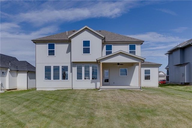 back of house with a lawn, a patio, and ceiling fan