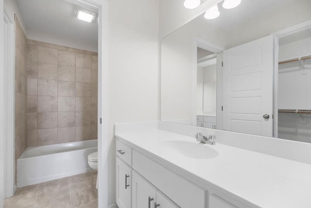 17157 W 164th Ter, Olathe, KS 66062 - bathroom featuring vanity, a walk in closet, and tub / shower combination
