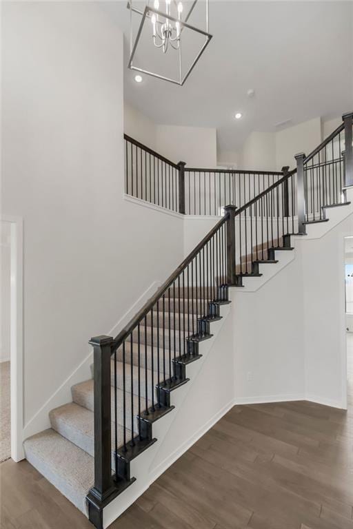 17157 W 164th Ter, Olathe, KS 66062 - stairs featuring wood finished floors, a chandelier, and recessed lighting