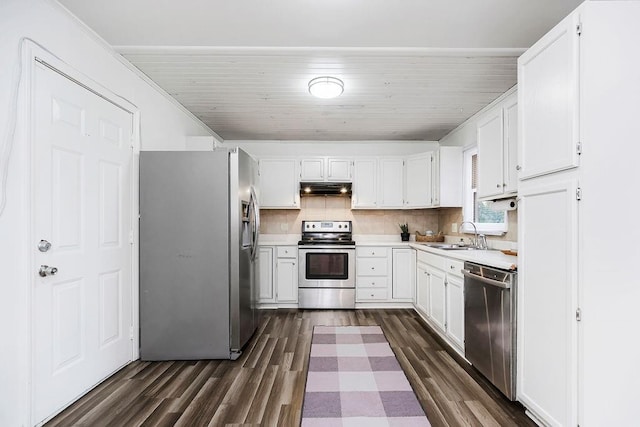 kitchen with decorative backsplash, white cabinetry, sink, and stainless steel appliances