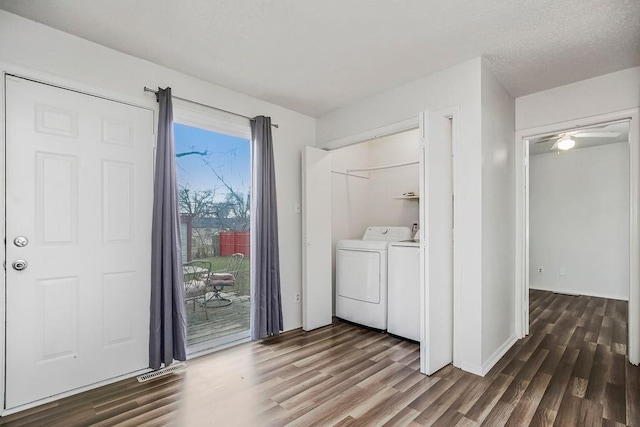 washroom featuring independent washer and dryer, ceiling fan, and dark wood-type flooring