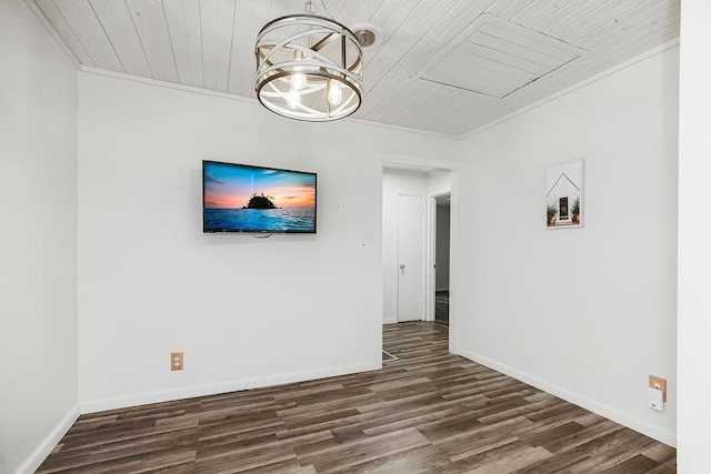 unfurnished room with wooden ceiling, dark hardwood / wood-style floors, ornamental molding, and a notable chandelier