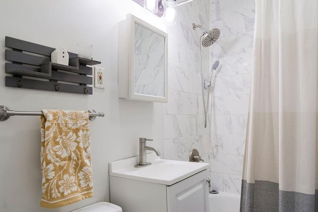 bathroom featuring vanity and shower / tub combo with curtain