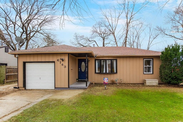 ranch-style home with a front yard and a garage