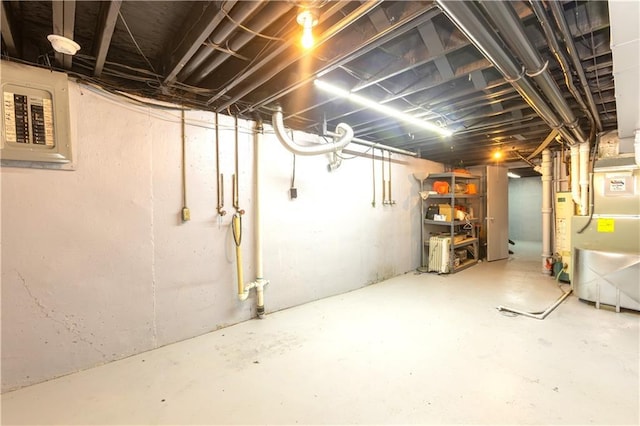 basement with electric panel and heating unit