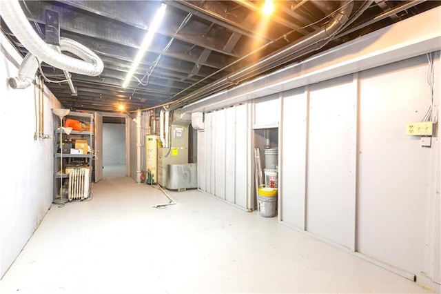 basement with heating unit and gas water heater