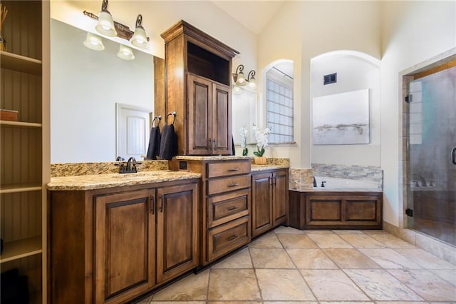 bathroom with vanity, vaulted ceiling, and plus walk in shower