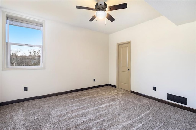 carpeted empty room featuring ceiling fan