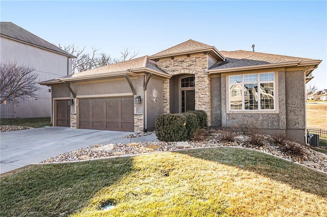 view of front of house featuring a garage and a front yard