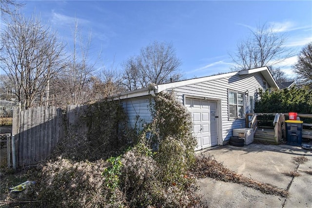 view of side of home with a garage