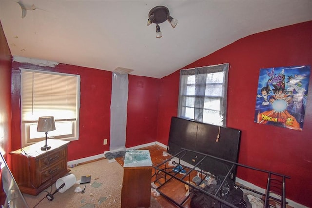 home office featuring lofted ceiling and a healthy amount of sunlight