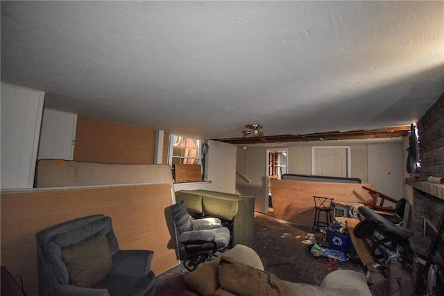 living room featuring a brick fireplace