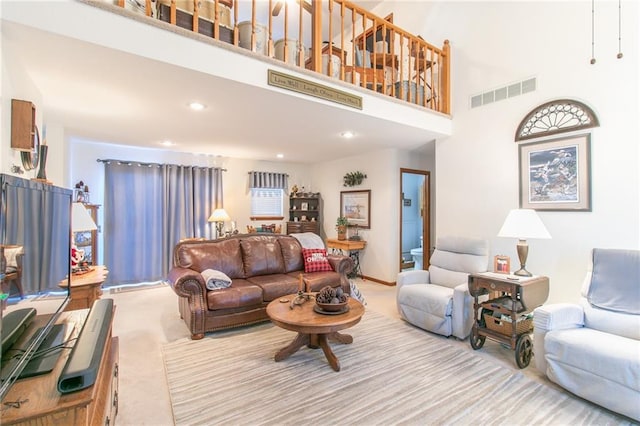 living room featuring a high ceiling