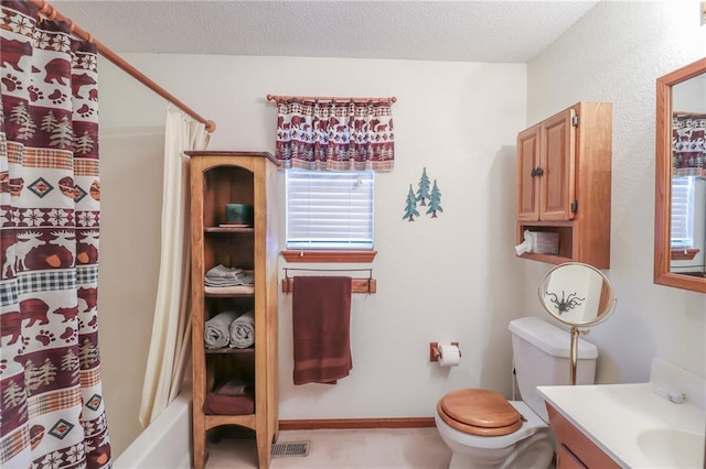 full bathroom featuring a textured ceiling, vanity, shower / bath combo, and toilet