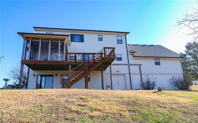 back of property with a sunroom and a lawn