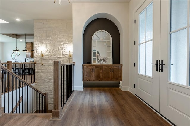 interior space with french doors and hardwood / wood-style flooring