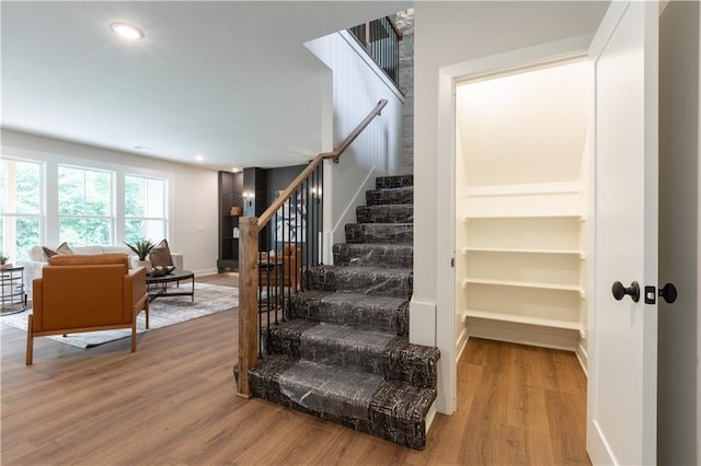 stairs with wood-type flooring