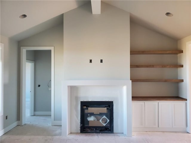 details featuring baseboards and a glass covered fireplace